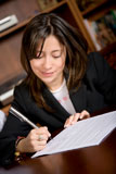 business+woman+signing+a+contract