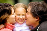 parents+kissing+daughter