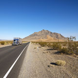 Truck+on+desert+road.