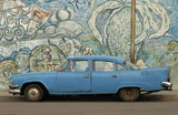 An+antique+car+parked+at+the+side+of+a+graffiti+covered+wall%2C+Havana%2C+Cuba