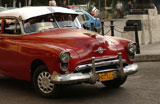 Front+view+of+an+antique+red+car%2C+Havana%2C+Cuba
