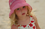 Close-up+of+a+young+girl+%286-8+wearing+a+sun+hat%2C+Moorea%2C+Tahiti%2C+French+Polynesia%2C+South+Pacific