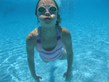 Underwater+view+of+a+young+girl+swimming%2C+Moorea%2C+Tahiti%2C+French+Polynesia%2C+South+Pacific
