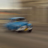 Blurred+view+of+a+car+on+a+road%2C+Havana%2C+Cuba