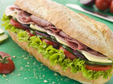 Deli+Sub+Sandwich+on+a+Chopping+Board