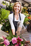 Woman+working+at+flower+shop+smiling