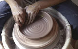 Close-up+of+a+man+working+on+a+pottery+wheel