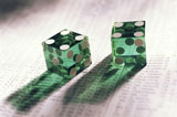 Close-up+of+a+pair+of+dice+on+a+financial+report