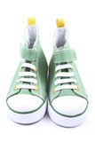 two+pairs+of+green+sneakers+for+children+close-ups