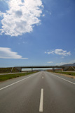 Bridge+and+road+horizon+front+perspective+view+in+a+sunny+blue+sky+