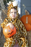 Caucasian+Boy+Wearing+A+Giraffe+Costume+And+Frowning+On+Halloween