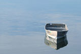 Empty+Boat+Floating+In+Tranquil+Waters