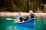 Couple+Relaxing+in+a+Canoe