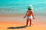 little+girl+on+sand+beach+near+sea