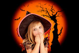 Halloween+scared+kid+girl+on+orange+background