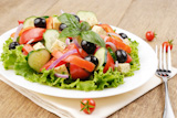 Greek salad on the white plate