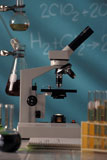 Microscope+And+Beakers+Sitting+On+Table+In+Science+Classroom