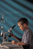 Boy+Using+Microscope+In+Chemistry+Class