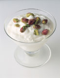 High+angle+view+of+yogurt+in+a+cup+topped+with+pistachios