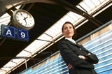 Businesswoman+standing+by+train
