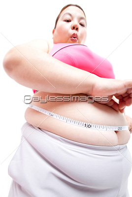 ウエストを測るメタボ女性 商用利用可能な写真素材 イラスト素材ならストックフォトの定額制ペイレスイメージズ