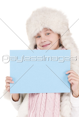 girl in winter hat with blank board