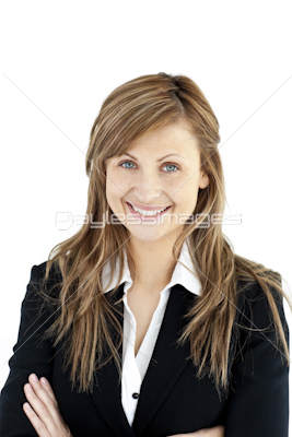 Assertive businesswoman with folded arms smiling at the camera