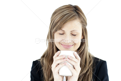Beautiful businesswoman enjoying her coffee