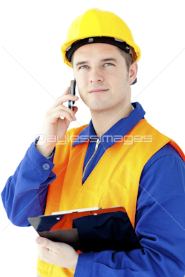 Charismatic worker talking on phone holding a clipboard