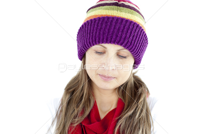 Depressed young woman wearing a cap and scarf