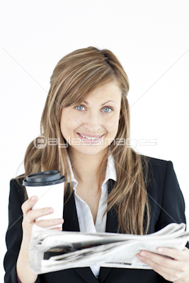 Elegant businesswoman reading newspaper holding coffee