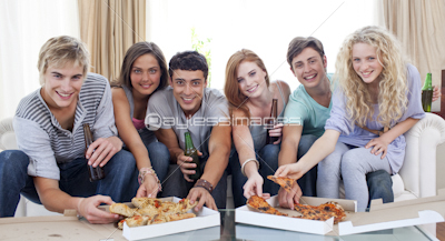 Friends eating pizza at home