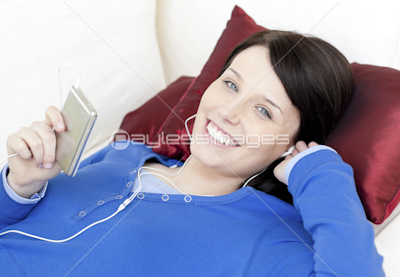 Jolly woman listening music with headphones