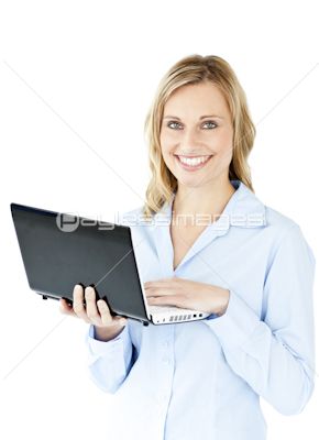 Jolly young businesswoman holding a laptop