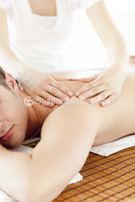 Resting man having a back massaga