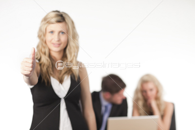 businesswoman with her thumb up to camera