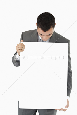 Businessman looking at sign in his hands