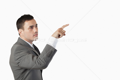 Businessman pressing an invisible key