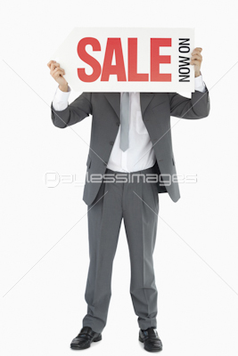 Businessman with sign in front of his head