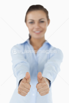 Businesswoman giving both thumbs up