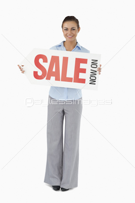 Businesswoman holding sign