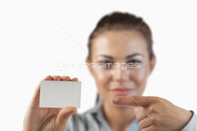 Close up of business card being pointed on by businesswoman