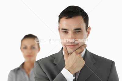Close up of businessman in thoughts with colleague behind him