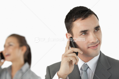 Close up of business partners talking on the cellphone