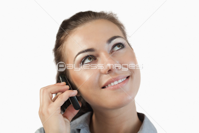 Close up of businesswoman on her phone looking diagonally upwards