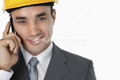Close up of confident smiling architect on the phone