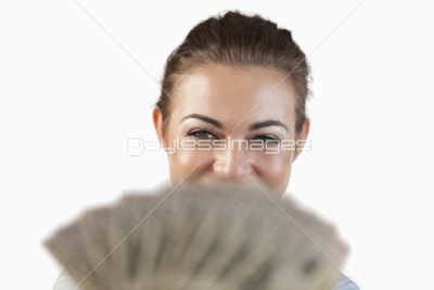 Close up of smiling businesswoman showing her bank notes