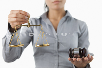 Gavel and scale being held by female lawyer