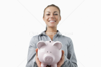 Piggy bank being held by bank assistant