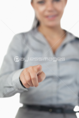 Portrait of a businesswoman pressing an invisible key